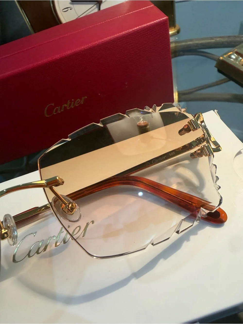 Cartier Men's Rimless Sunglasses with Purple Lenses and Gold Bridge